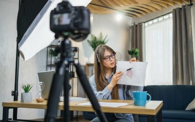 Business woman recording masterclass on video camera